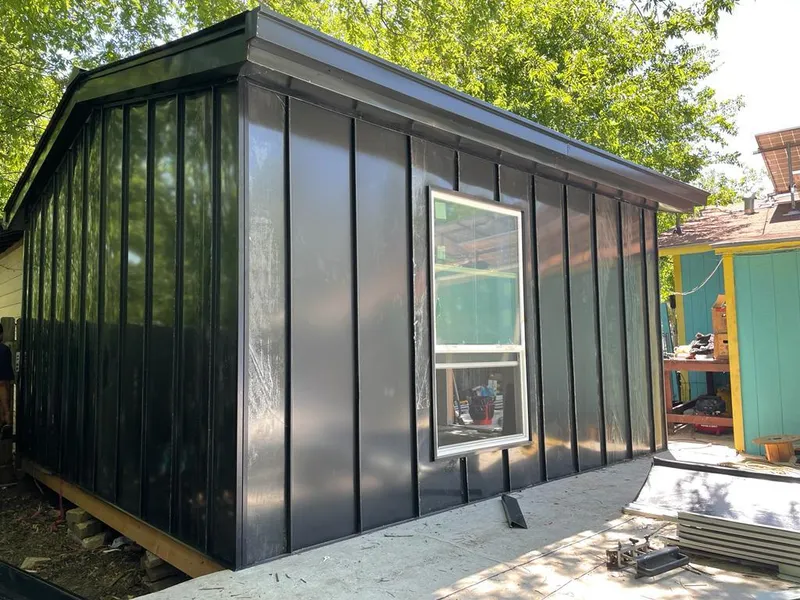 Black standing seam metal wall panels for Roof Inspection in Dalhart